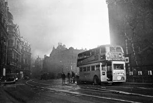 Air Raids Prints: A bus to Willesden Junction is stationary in what looks like The Aldwych area of London