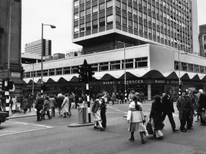 Cities Prints: Busy street scene showing pedestrians crossing the road at the corner of Cross Street