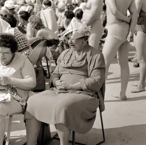 Paper Prints: Butlins Holiday Camp in Minehead An elderly lady sitting on a chair wearing paper