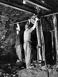 The C. P. Hole-boring machine is being used to bore apertures in the coal face - the same
