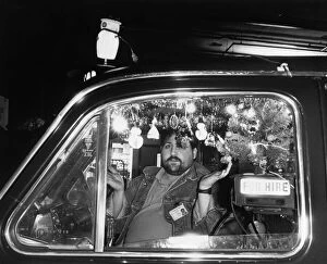 Images Dated 7th December 1988: A Cabbies Christmas spirit was dashed after council officials objected to fairy