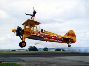 A Cadburys Crunchie Boeing-Stearman Model 75 biplane, with wing walker onboard