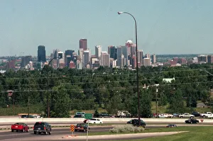 Canada Prints: Calgary city in Canada with freeway, July 1999. Motorcycle