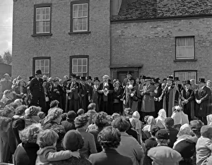 Cambridge mayor Leonard D. V. Wordingham throws pennies to the children at the Reach