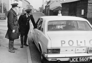 Motors Prints: Cambridgeshire police officers beside a Ford Zephyr Police car, October 1968