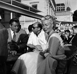 Cannes Film Festival 1953. Right Lex Barker with Donald Zec and actress Lana Turner