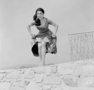 Cannes Prints: Cannes Film Festival. Actress Vanja Orico seen here dancing for some sailors. D3118-037