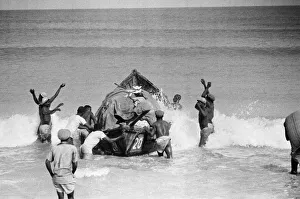 Canoeists of Lagos, Nigeria bringing goods from ships anchored off the coast