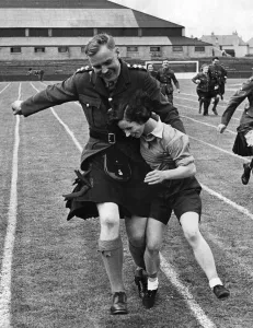 Captain Smith of the Black watch seen here with volunteer Fachie competing in the three