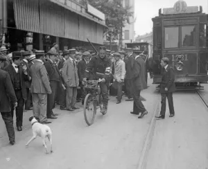 Tram Prints: A Carabineer cyclist seen here making his way through the streets of Brussels