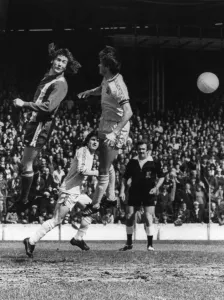 Jumping Prints: Cardiff City inside forward, Robin Friday beats Burnley striker Paul Fletcher in the air