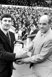 Presentation Prints: Cardiff City manager Jimmy Scoular receives a gallon bottle of Bells Whisky as manager of