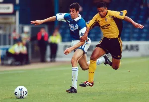00759 Prints: Cardiffs Mark Delaney beats Fulhams John Salako to the ball