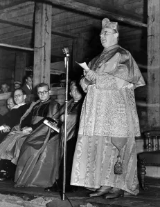 Cardinal Griffin addresses the gathering after laying the foundation stone of the new De