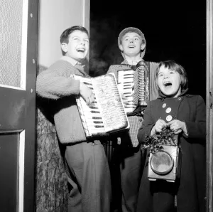 00202 Prints: Three Carol singers from Canton, Cardiff, who tour the neighbourhood at Christmas time