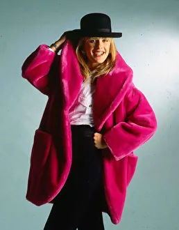 Occupation M Prints: Carol Smillie model TV presenter wearing pink fake fur coat and black hat