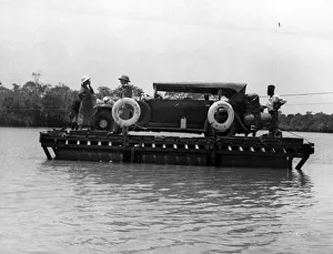Raft Prints: One of Carr-Hartleys cars arriving by Ferry after crossing the Zambezi river