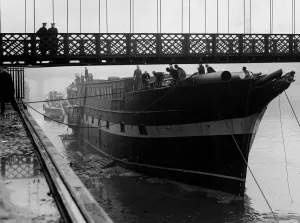 The Carrick last of the wool clippers 1954, slips under suspension bridge on her way to a