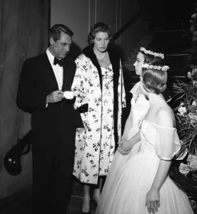 Necklace Prints: Cary Grant and Ingrid Bergman chat to two dancers between takes filming Indiscreet