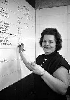 Writing Prints: Cashier Dorothy Penfold of a Ladies only betting shop in Worcester