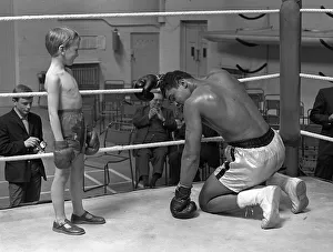00029 Prints: Cassius Clay with 6 year old Patrick Power in the ring during his training for