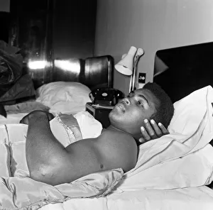 Portrait Posed Prints: Cassius Clay aka (Muhammad Ali) catches up on some sleep in the Piccadilly Hotel