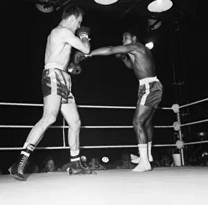 01011 Prints: Cassius Clay aka (Muhammad Ali) vs Henry Cooper in their first fight at Wembley Stadium