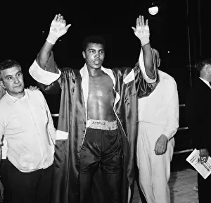 Cassius Clay aka (Muhammad Ali) vs Henry Cooper in their first fight at Wembley Stadium