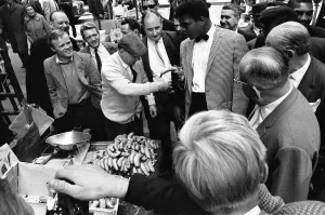 Market Trader Prints: Cassius Clay aka (Muhammad Ali) walks around a market in Soho on the day of his arrival
