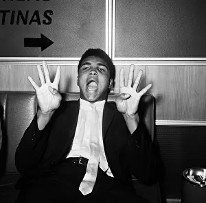 Cassius Clay, aka (Muhammad Ali) on his way back to the United States after beating