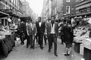 Market Prints: Cassius Clay (centre) and entourage walking through Berwick market on route to his press