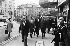 Cameraman Prints: Cassius Clay (centre) and entourage walking down Charing Cross Road on route to his press