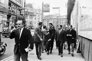 Entourage Prints: Cassius Clay (centre) on his way to a press conference ahead of his rematch with Henry