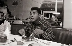 Anger Prints: Cassius Clay eating Steaks at Isows restuarant in Brewer Street, Soho, London