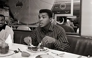 Eating Out Prints: Cassius Clay eating Steaks at Isows restuarant in Brewer Street, Soho, London