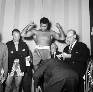 00753 Prints: Cassius Clay and Henry Cooper (left) at the the weigh-in for their first encounter