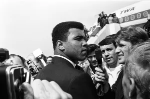 Microphones Prints: Cassius Clay Muhammad Ali) arrives in England ahead of his rematch with Henry Cooper