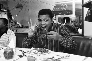 Cassius Clay (Muhammad Ali) eating stake at Isows restaurant in Soho Brewer Street London