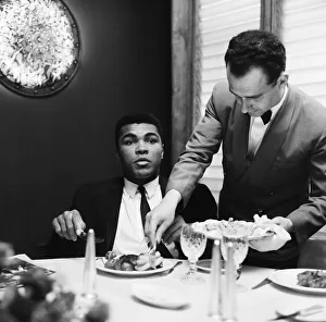 Cassius Clay (Pictured) having lunch in London before his trip to Scotland for an