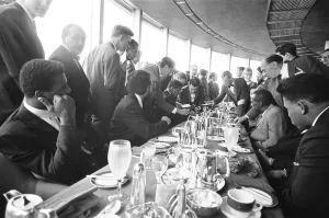 Cassius Clay seen here signing autographs whilst he was attending a lunch at the top of