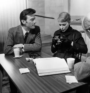Cast and crew on the set of A Dandy in Aspic. The scene is representing a checkpoint in