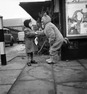 The cat from Dick Whittington seen here shaking hands with a young admirer after being