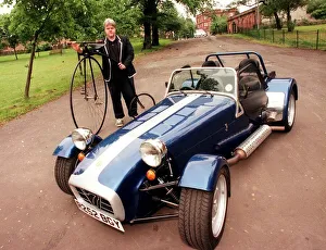 Caterham sports car July 1998 John Moran holding a Penny Farthing bicycle bike