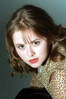 Catriona Evans looking sultry wearing leopard design silk blouse light brown shoulder