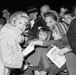 Fur Coat Prints: Celebrities including singer Kathy Kirby and Bruce Forsyth singing carols in Trafalgar