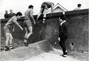 CELTIC FC SEAMILL PLAYERS CLIMBING OVER THE WALL JOCK STEIN Circa