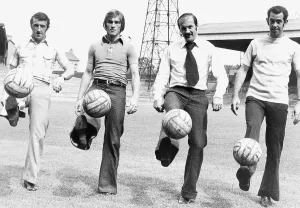 Celtic FC team players Danny McGrain Kenny Dalglish (L) Harry Hood Tom Callaghan kicking