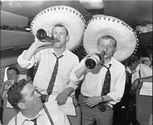 Celebrating Prints: Two Celtic Players (IDs to follow) enjoy their champagne on the plane home