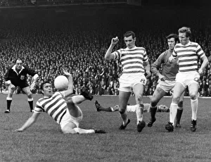 Celtic v. Rangers Bobby Murdoch clears for Celtic as Colin Stein lies injured in