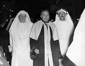 Poetry Prints: The chaired bard, T Llew Jones of Llandysul is escorted to the platform at the Eisteddfod